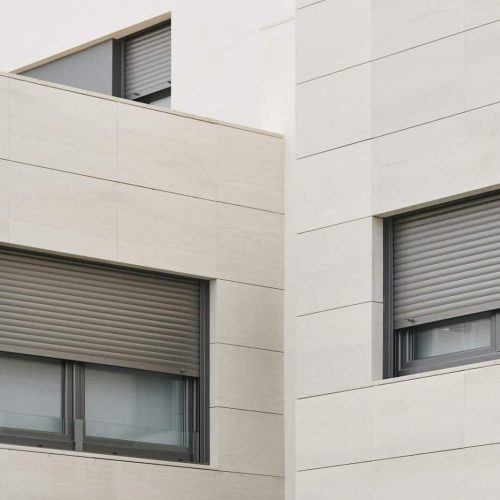 New building exterior facade with tiles. Construction. Buy, rent